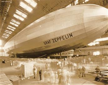 (DIRIGIBLES) A group of 11 photographs depicting dirigibles in air or parked in giant hangers, primarily American vessels.